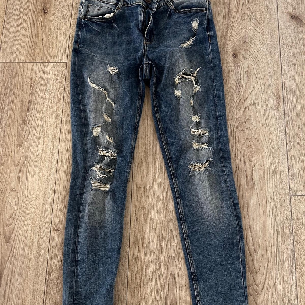 Distressed Blue Jeans